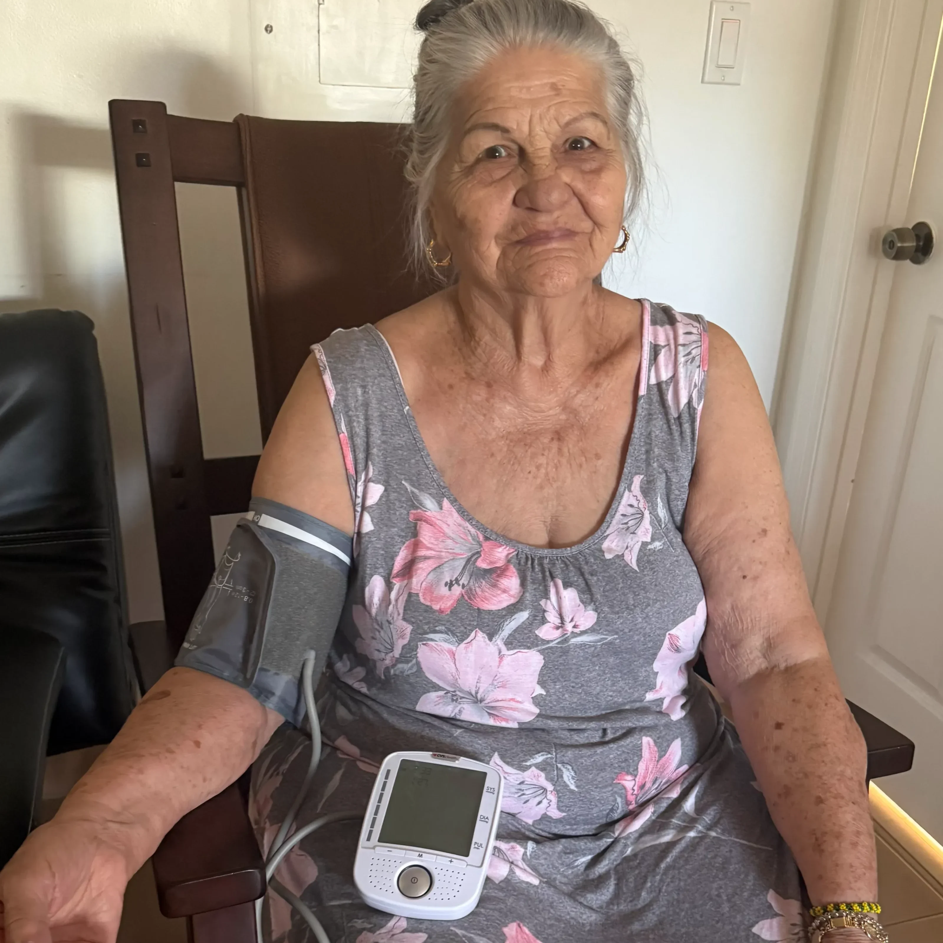 Woman in floral dress with arm cuff